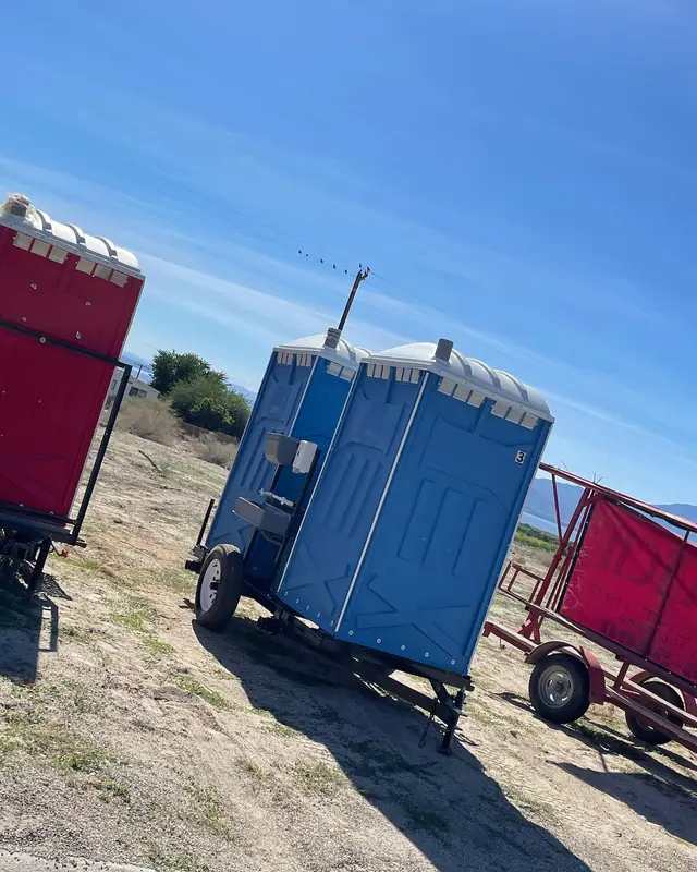 Porta potties on a delivery trailer