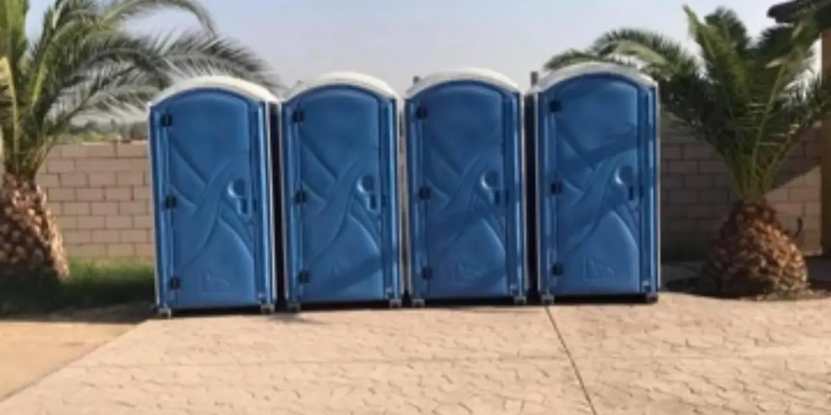Row of blue porta potties set for an event