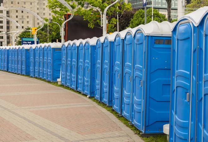 a row of portable restrooms at a fairground, offering visitors a clean and hassle-free experience in wagener
